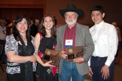 John with Leah Hultonschmidt, editor at Dorchester Publishing, along with his wife, Rocio, and son, Dimitri, at the WWA convention in Oklahoma City in 2009.