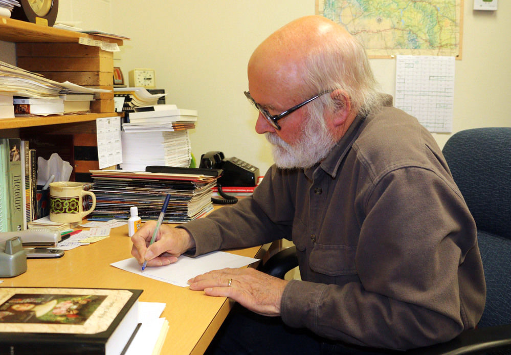 John writing notes John writing some notes in his office